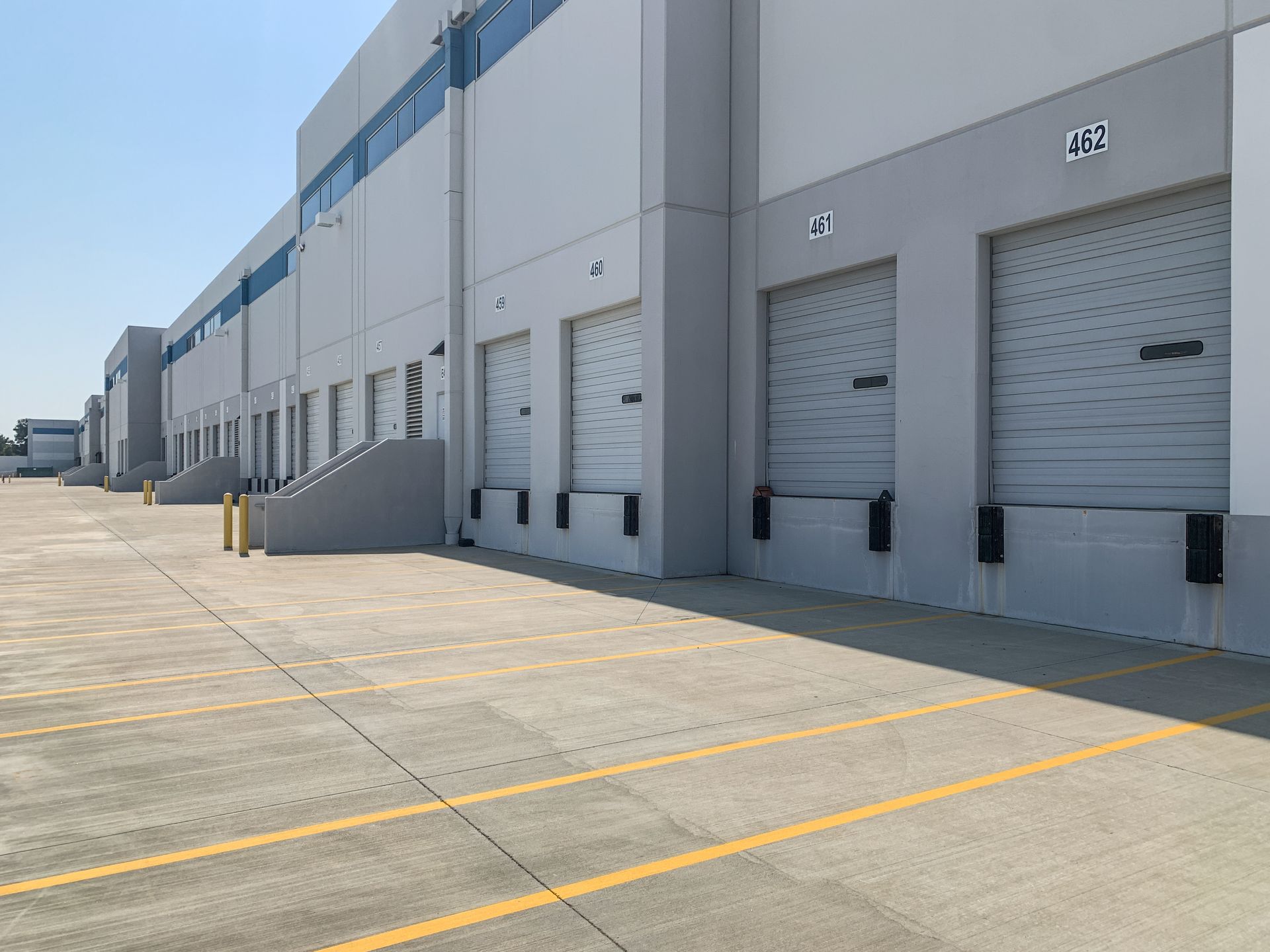 Commercial concrete service loading dock bays and reinforced flatwork at a warehouse facility.