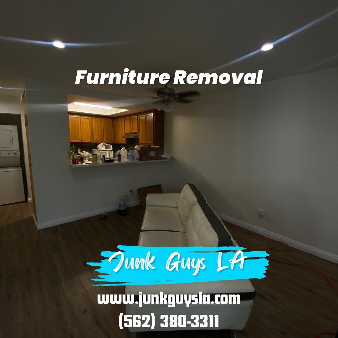 A couch positioned near the door, ready for removal by a junk removal service.