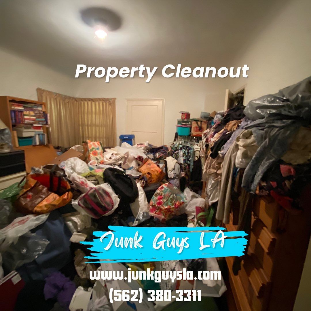 A cluttered room overflowing with various items, including old boxes, and household goods, creating a chaotic scene.