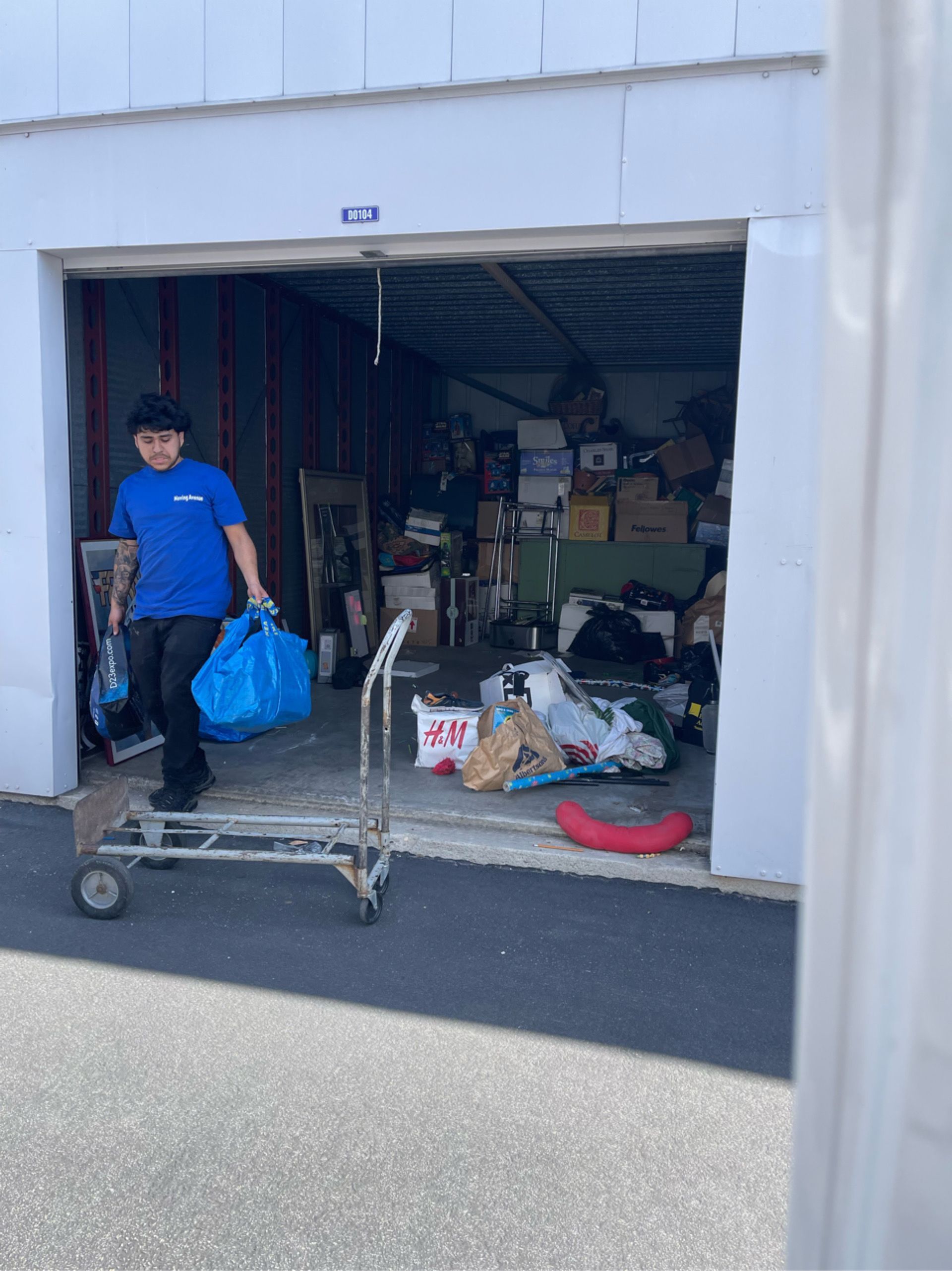 Junk Guys LA team actively removing clutter from a storage unit, providing efficient junk hauling services.