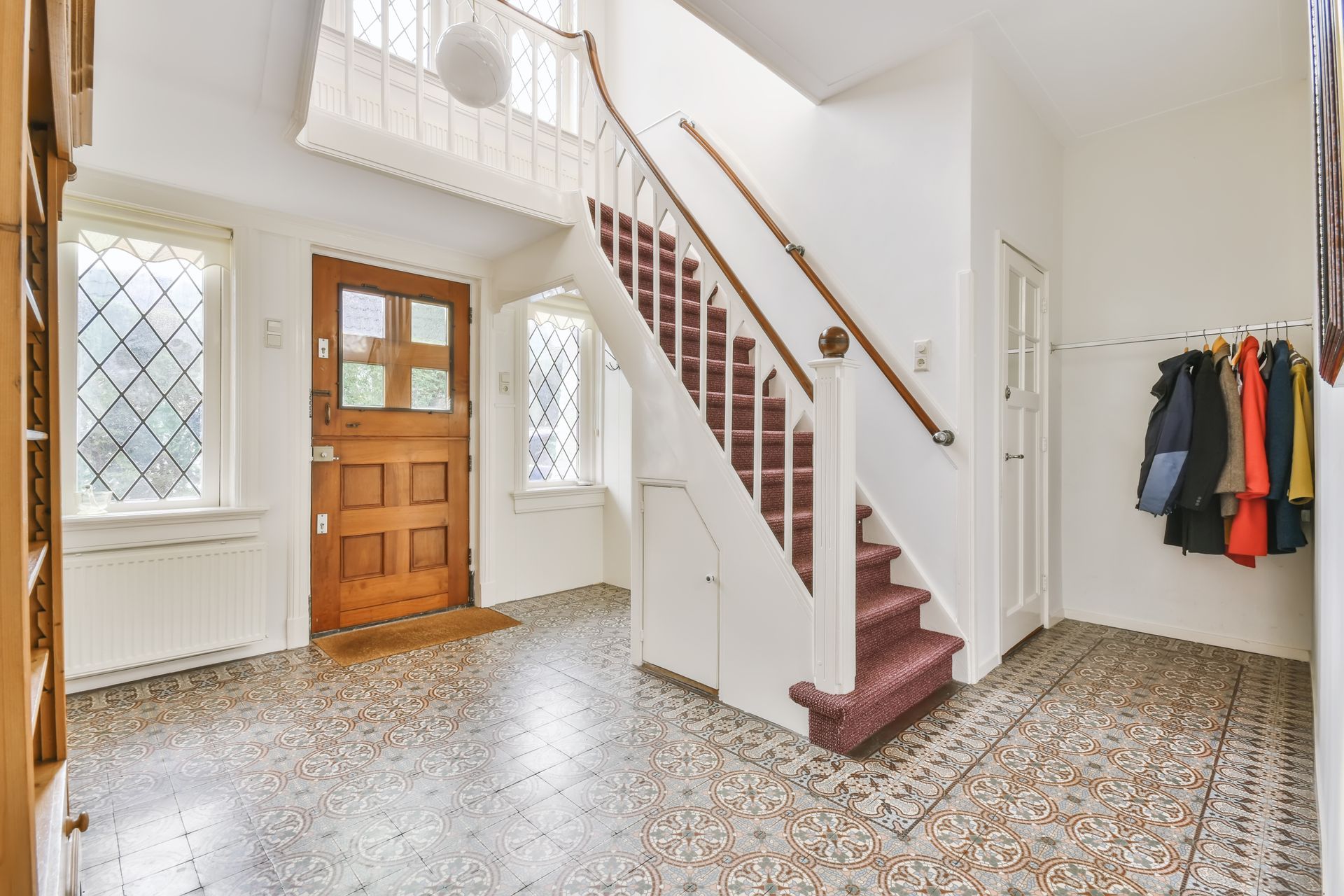 entrance hall with wooden door and windows