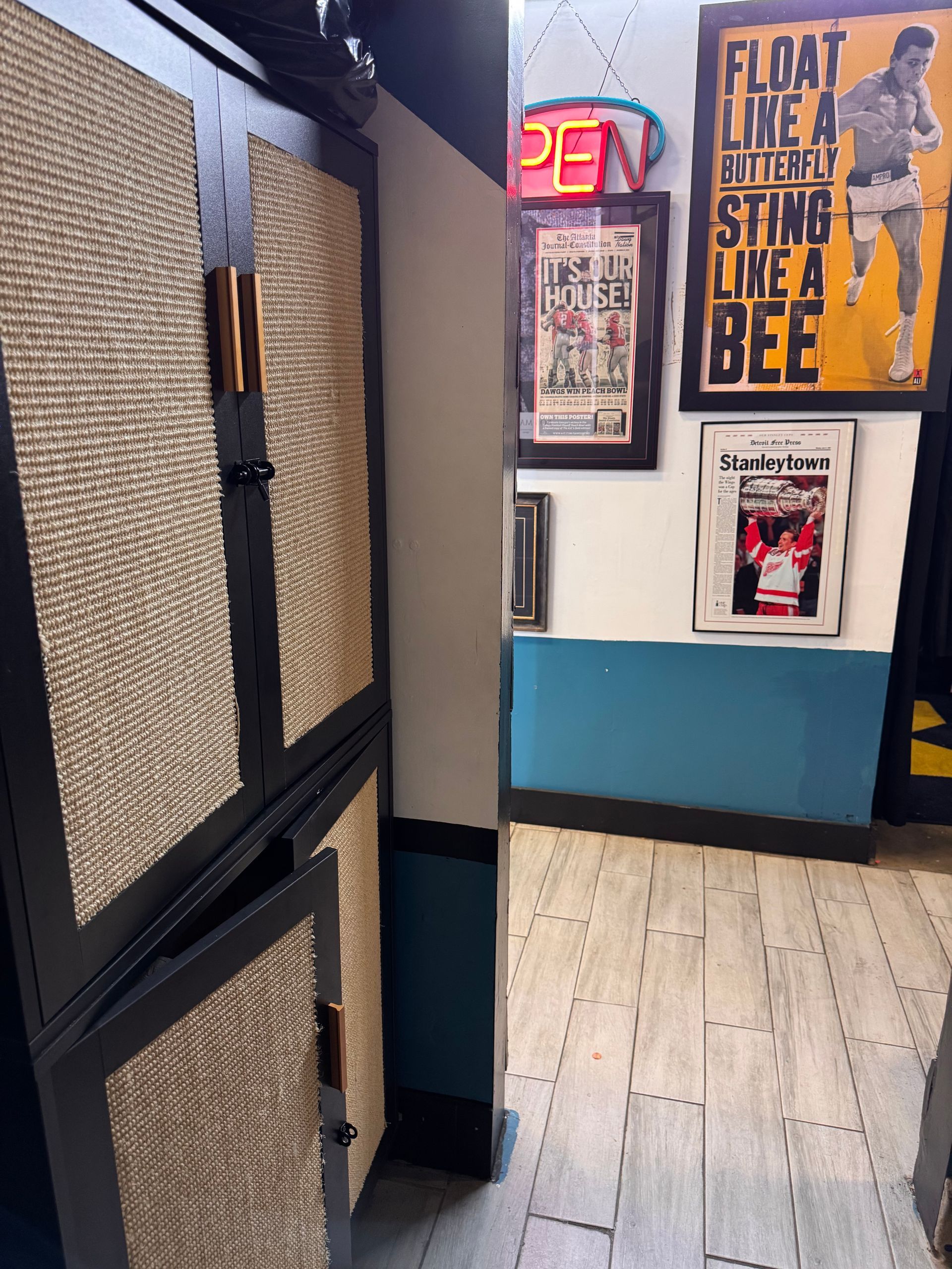 A room with a sign that says float like a butterfly sting like a bee