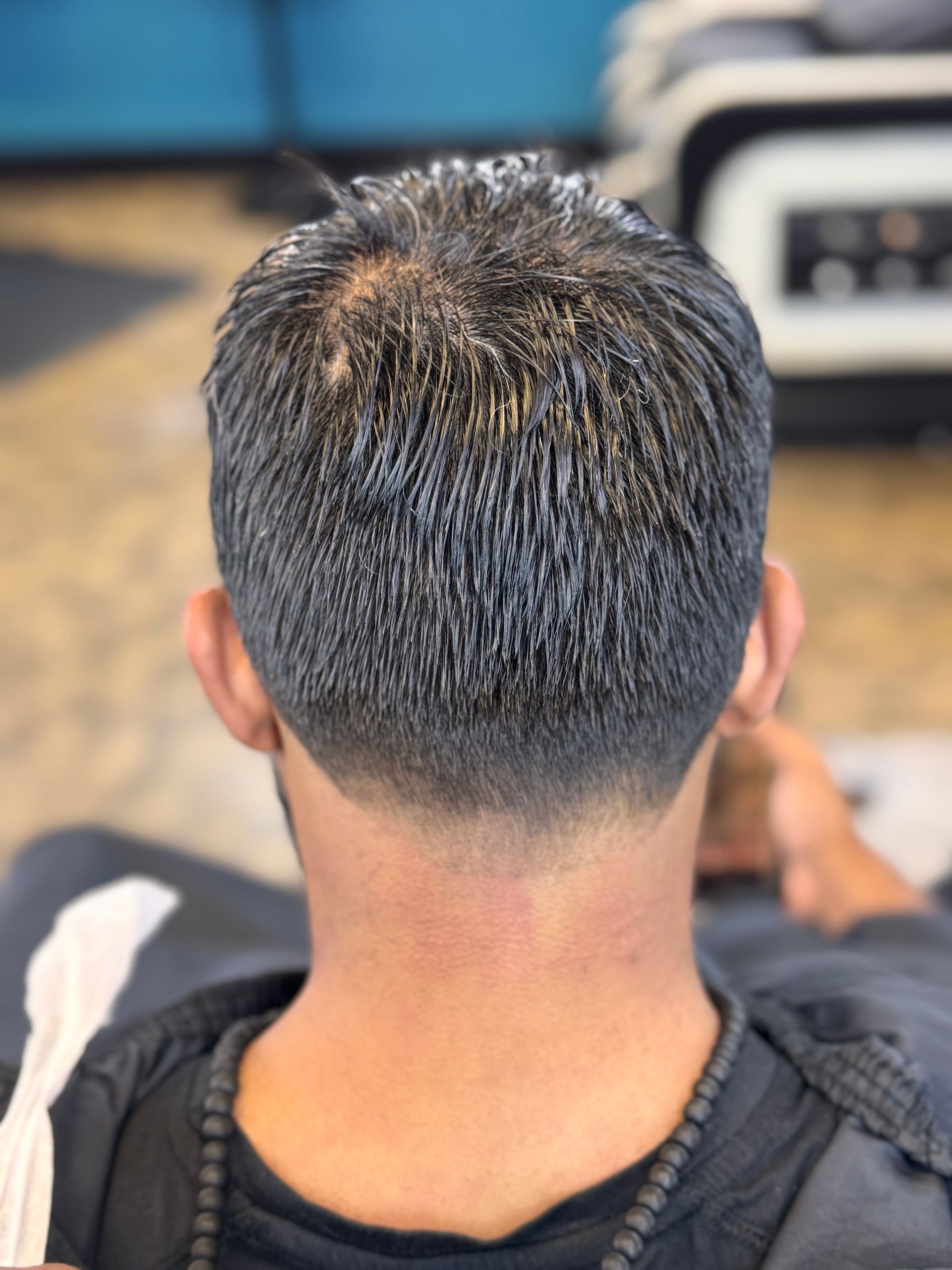 The back of a man 's head with gray hair