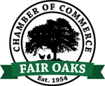 The logo for the fair oaks chamber of commerce is a tree in a circle with a green ribbon.