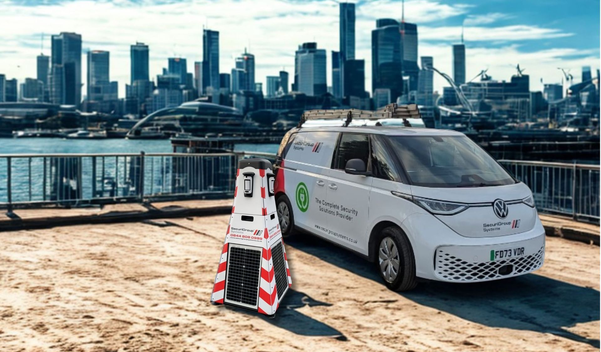 A white van is parked in front of a city skyline.