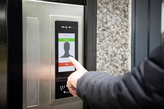 A person is using a smart phone to make a call.