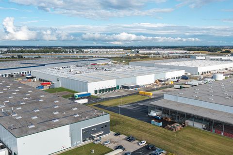 An aerial view of a large industrial area with lots of warehouses.