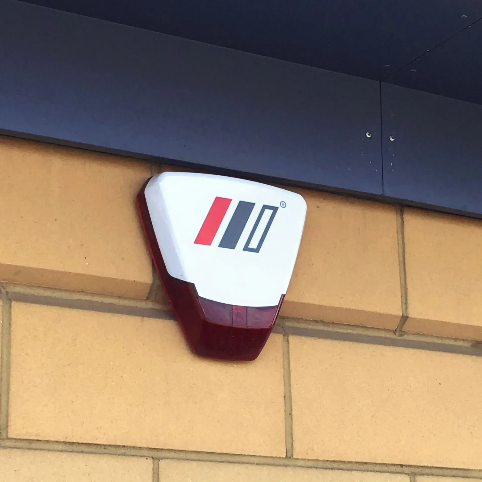 A red and white sign that says iii on it