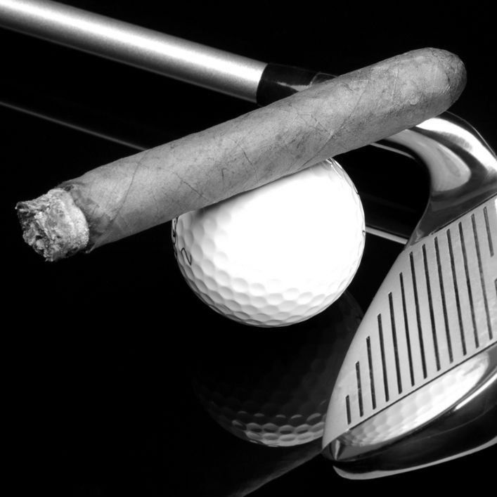 golf clubs and cigar