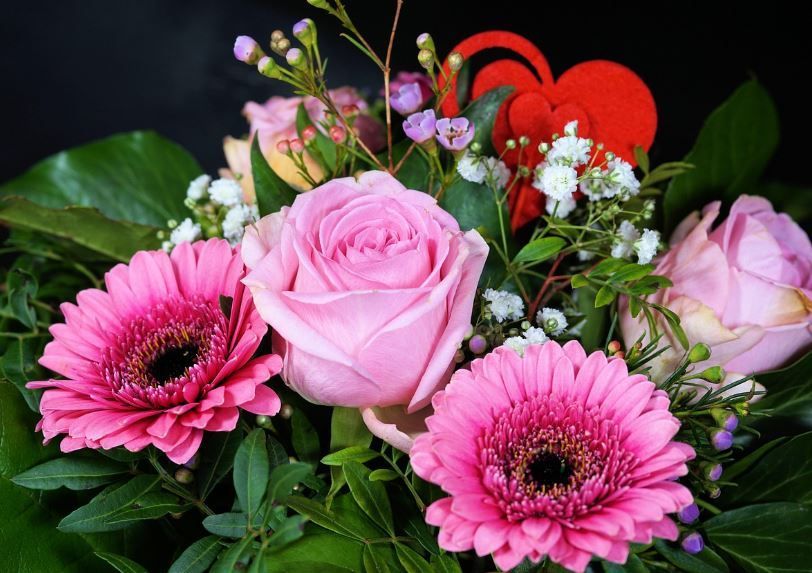 Pink rose and gerbera arrangement with baby's breath accents, funeral homes Moore, OK