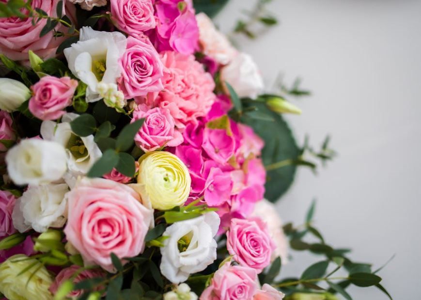 Pink rose bouquet with white blooms and greenery, Oklahoma City, OK celebration of life arrangement