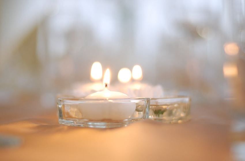 Memorial candles glowing gently, reflecting trusted cremation services Moore, OK care