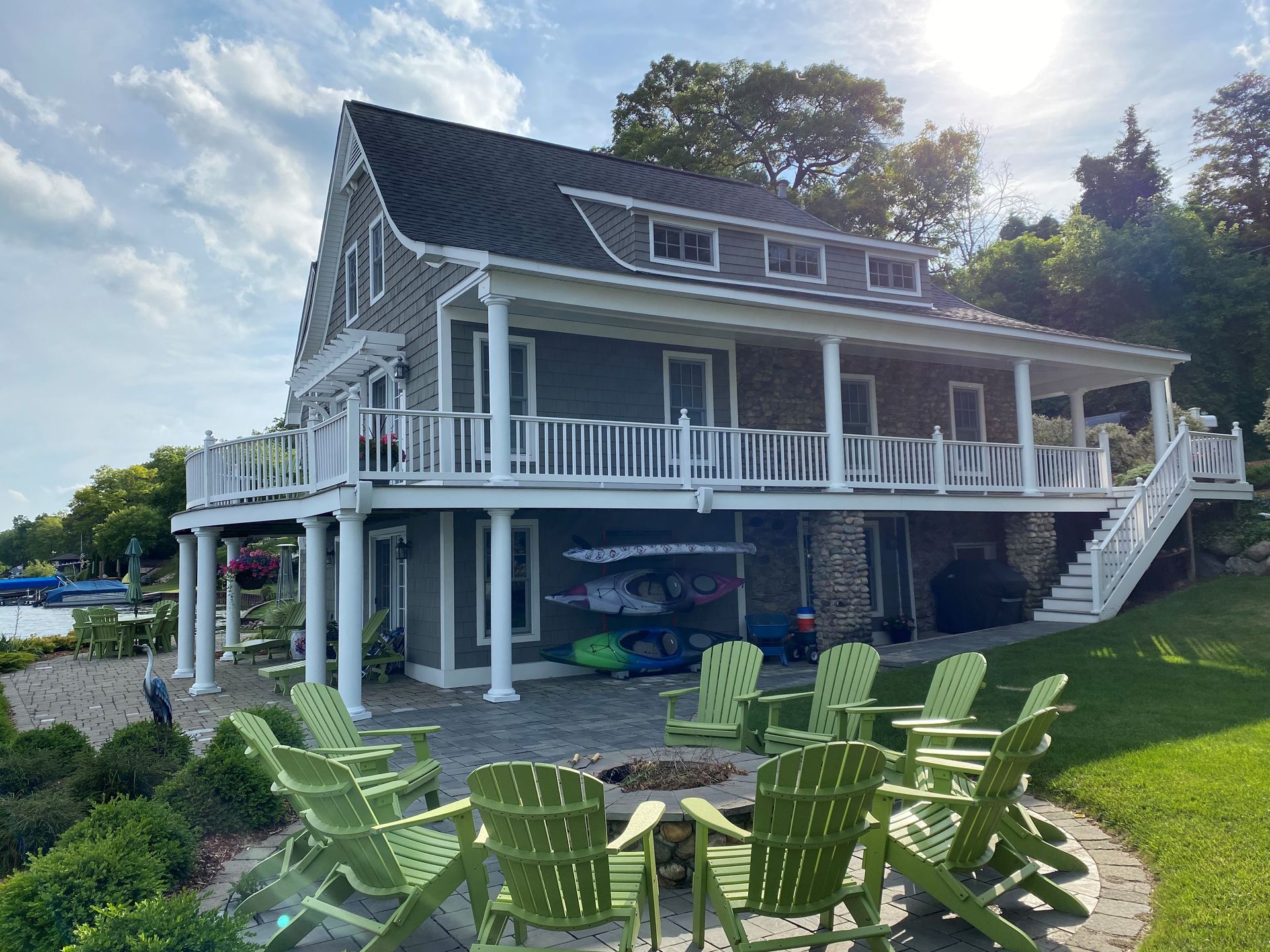 A person is pouring pink paint into a bucket.