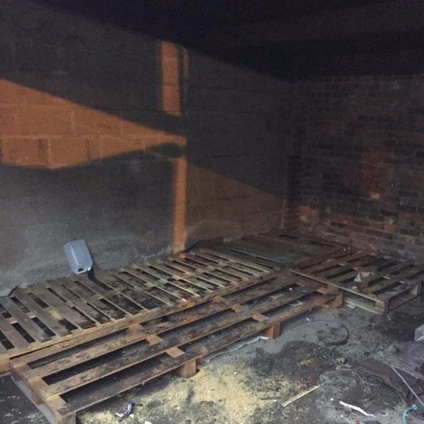 CLEARED CARPET WASTE PILE AFTER WASTE COLLECTION IN WEST READING WOODEN PALLETS LEFT IN STORE