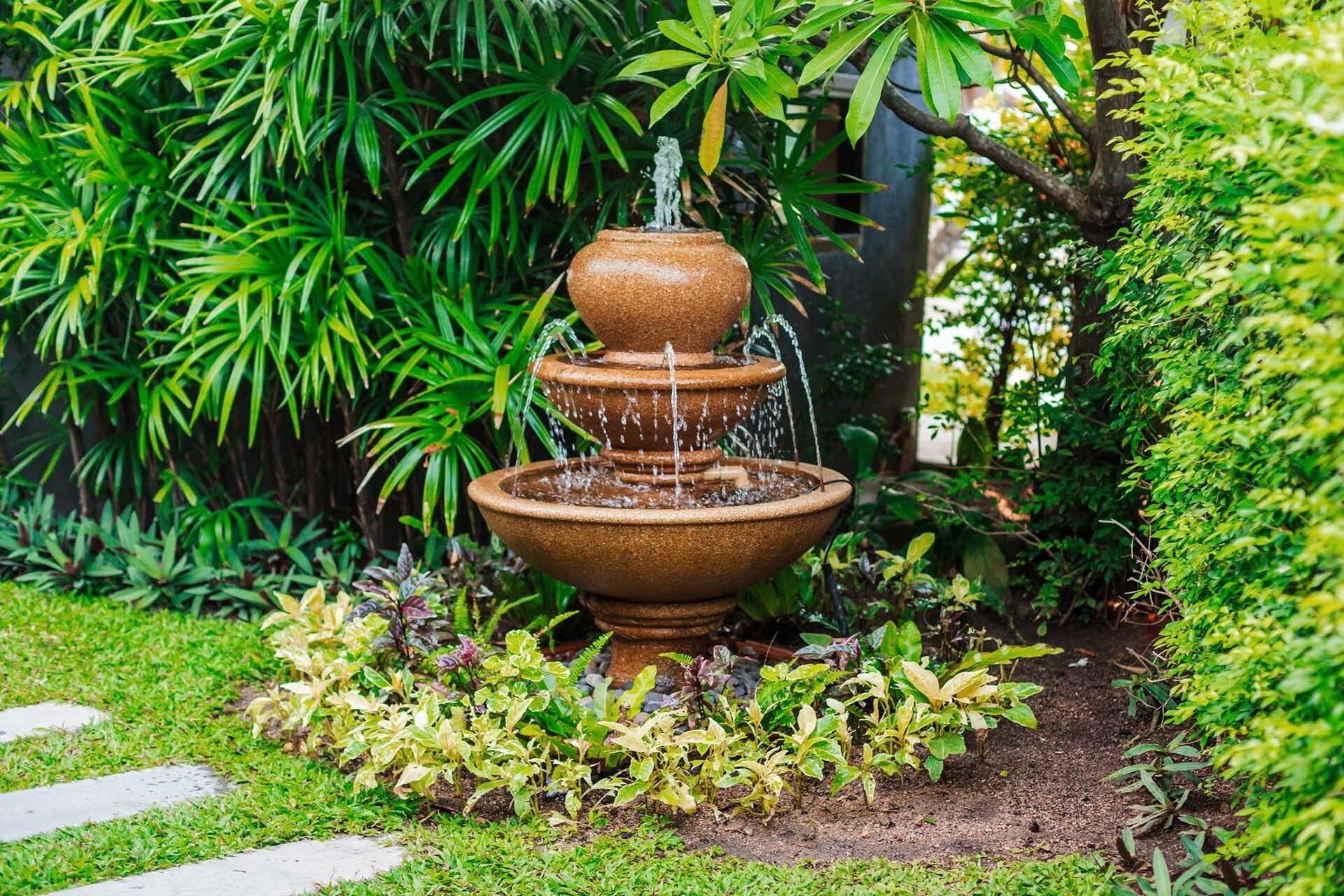 Fountain in Garden — Asheville, NC — Green Outdoors Landscaping & Nursery