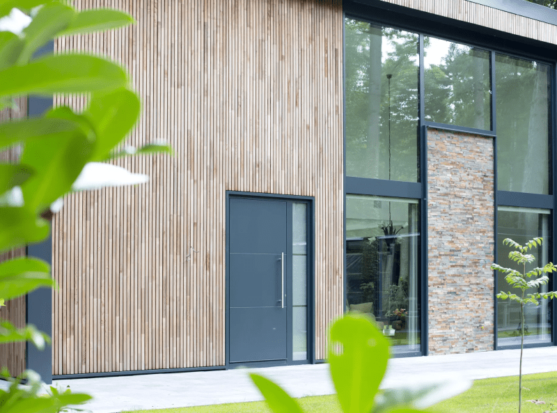 A house with a lot of windows and a balcony