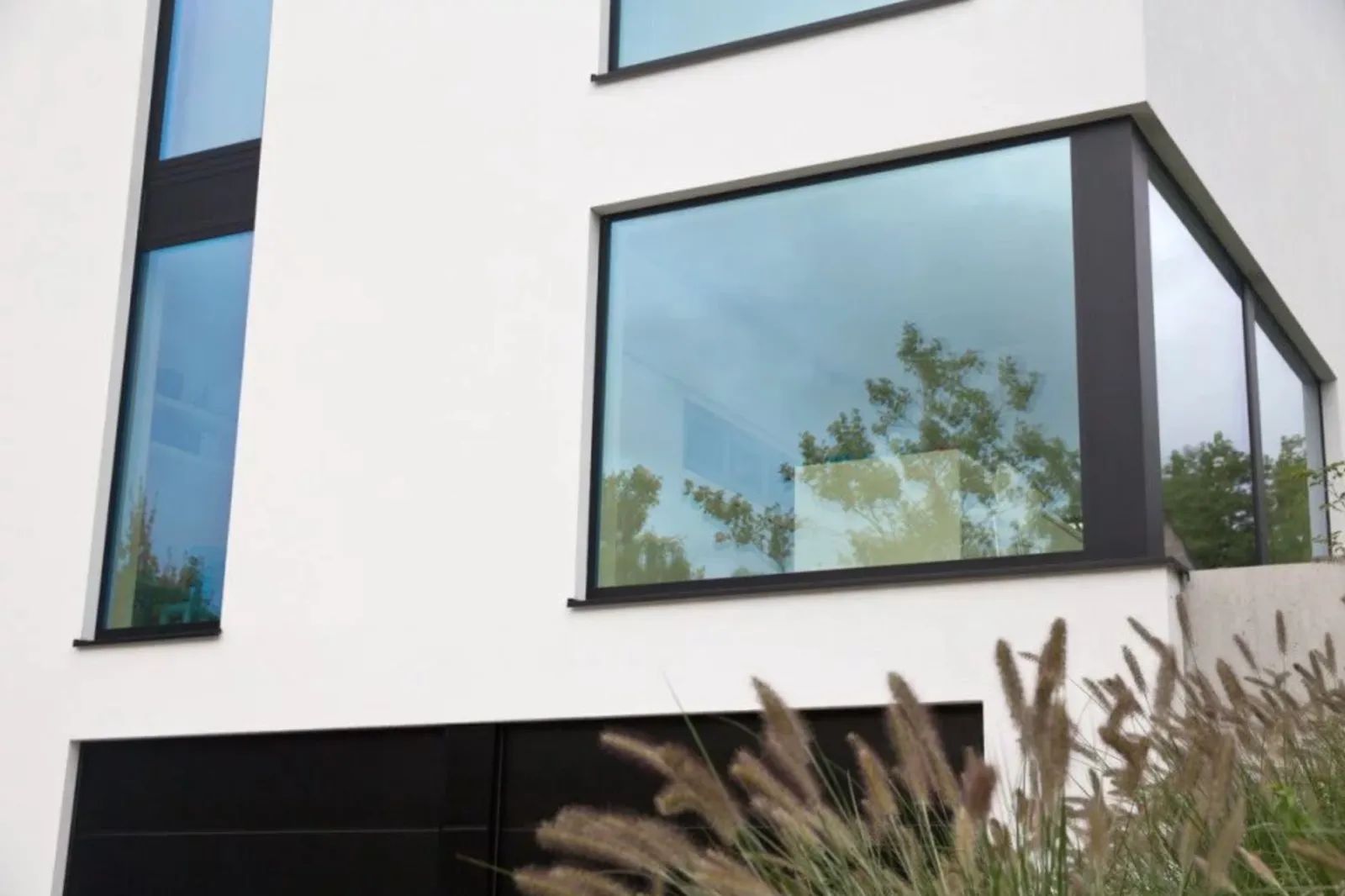A house with a lot of windows and a balcony