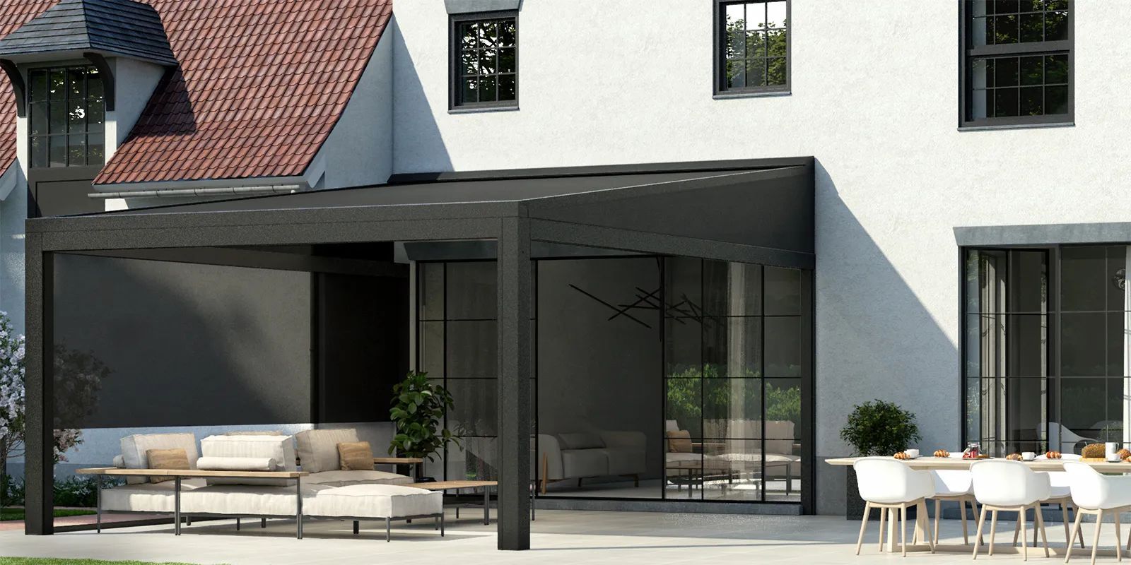 A white building with a lot of windows and trees reflected in the windows.