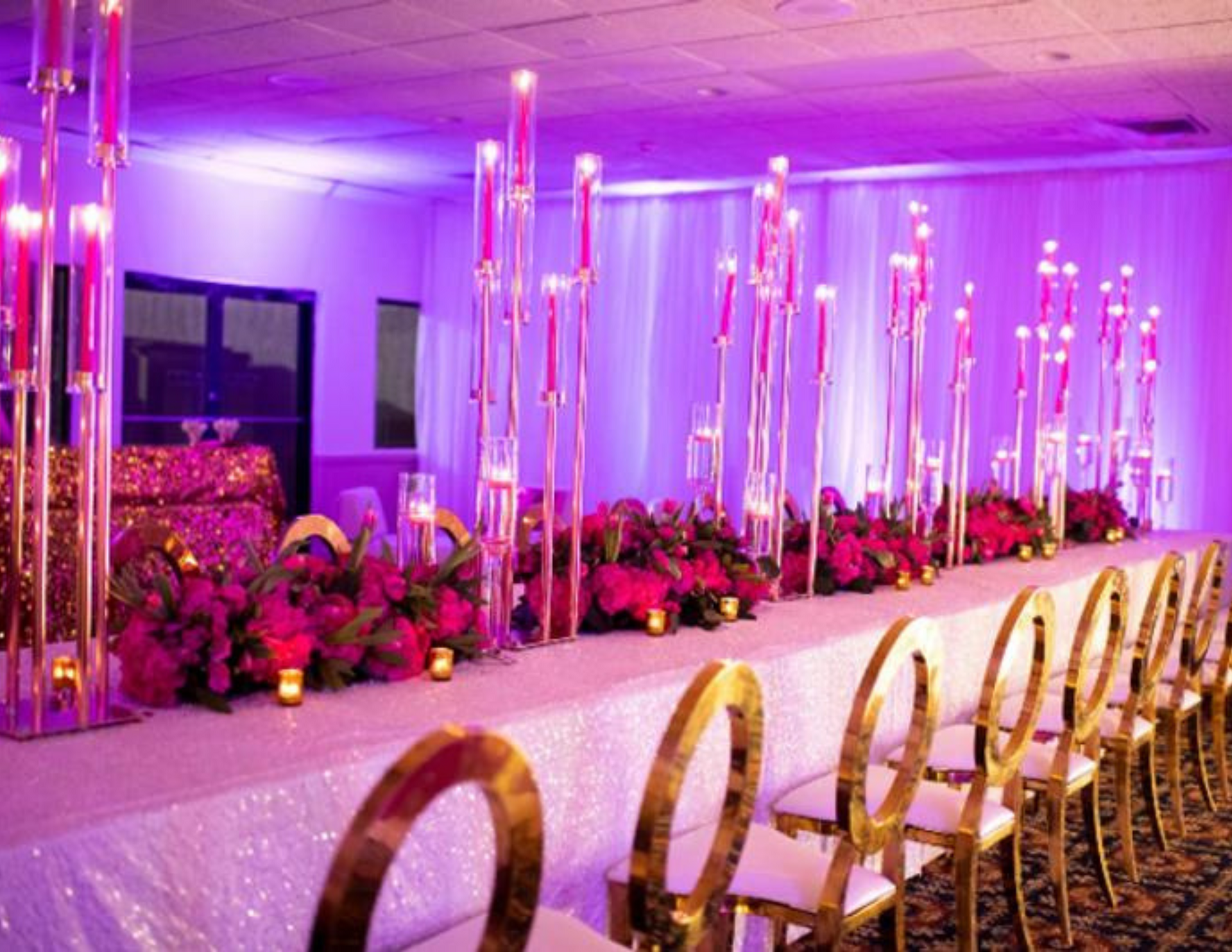 gold o-back chairs at pink table with candles and florals