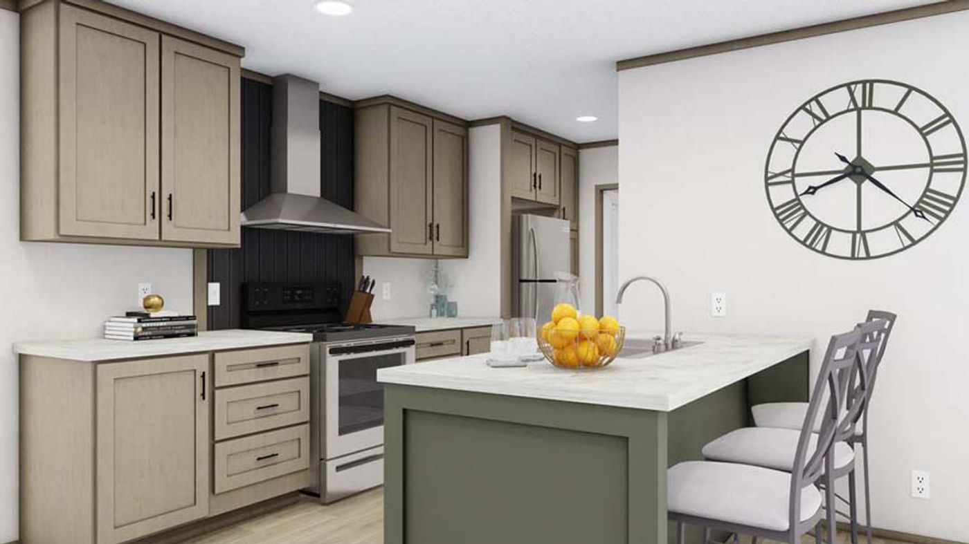 A kitchen with a large clock on the wall above the sink.