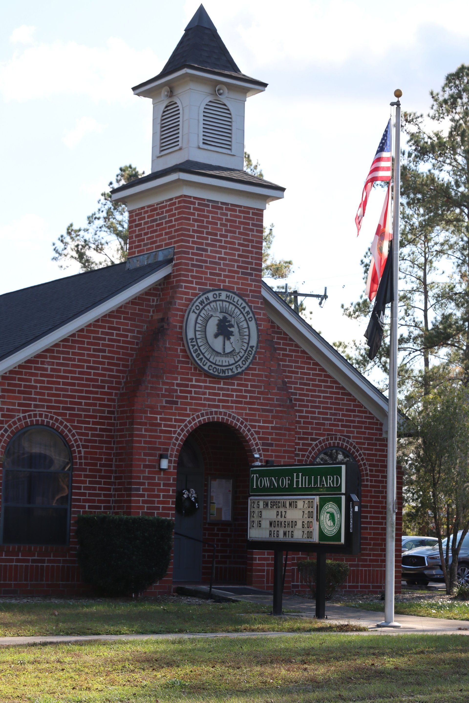 A brick church with a sign that says north on it