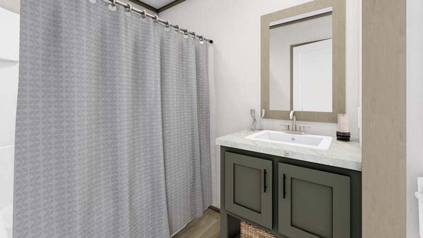 A bathroom with a sink , mirror and shower curtain.