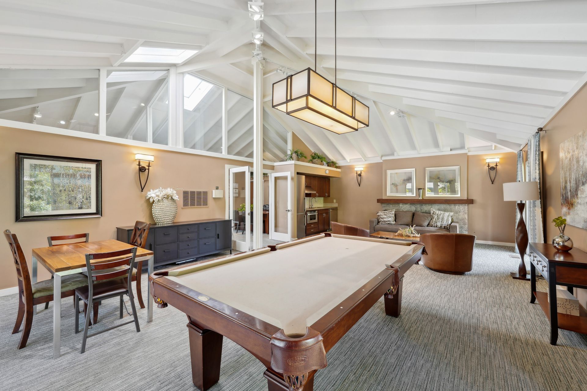 There is a pool table in the middle of the room.