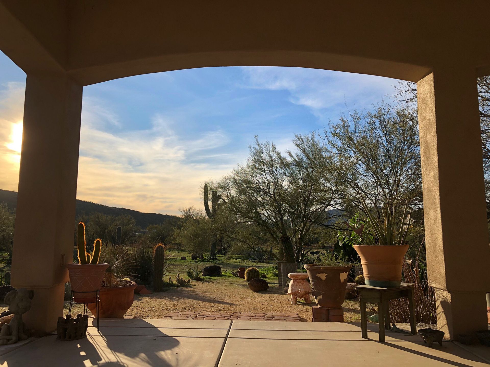 A view of a desert landscape through an archway
