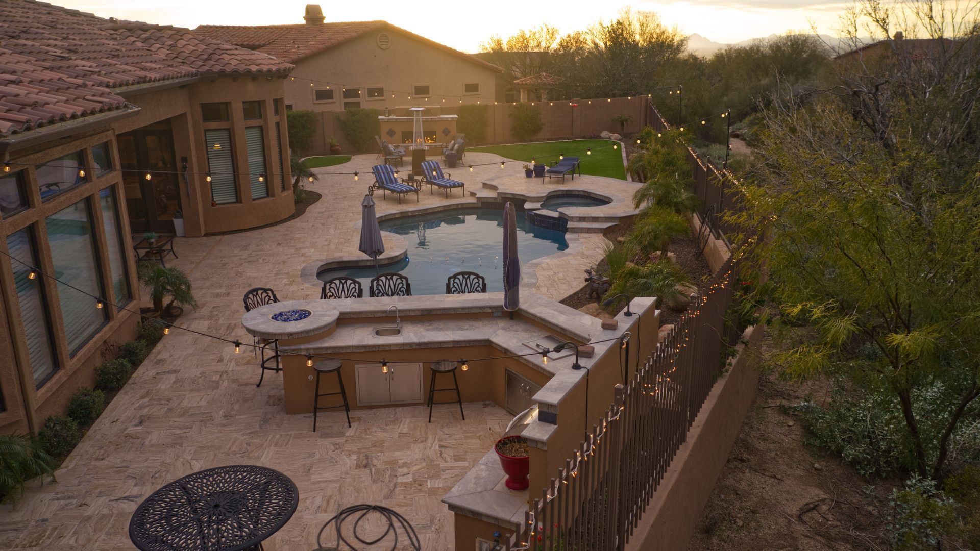An aerial view of a large house with a swimming pool