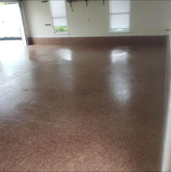 Brown speckled garage floor with a glossy finish.