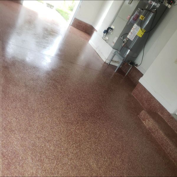 Brown speckled epoxy garage floor.