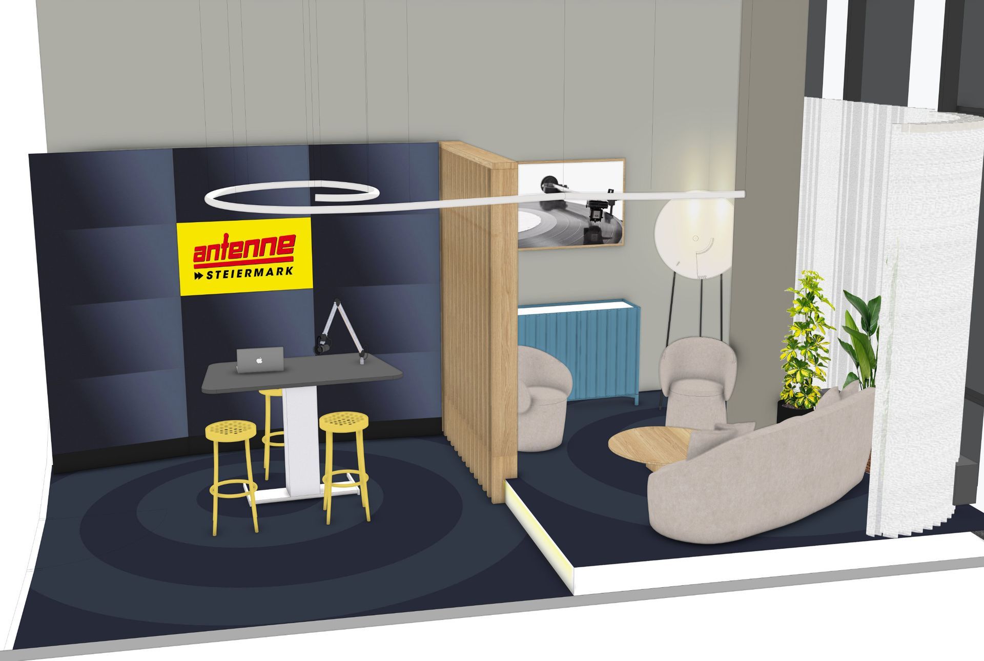 Innenansicht eines Studioraums mit Sitzgelegenheiten, Theke und Trennwand in neutralen Tönen und blauen Akzenten.