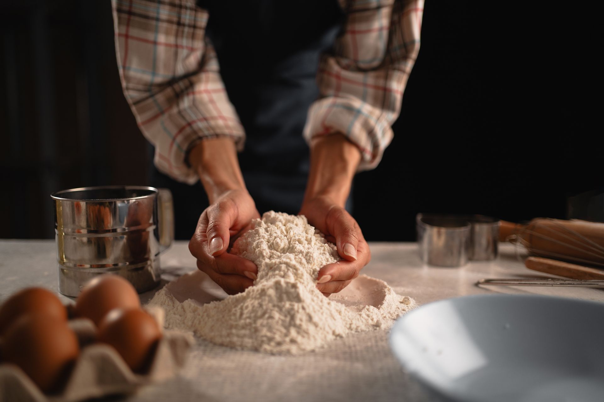 Hands kneading flour.