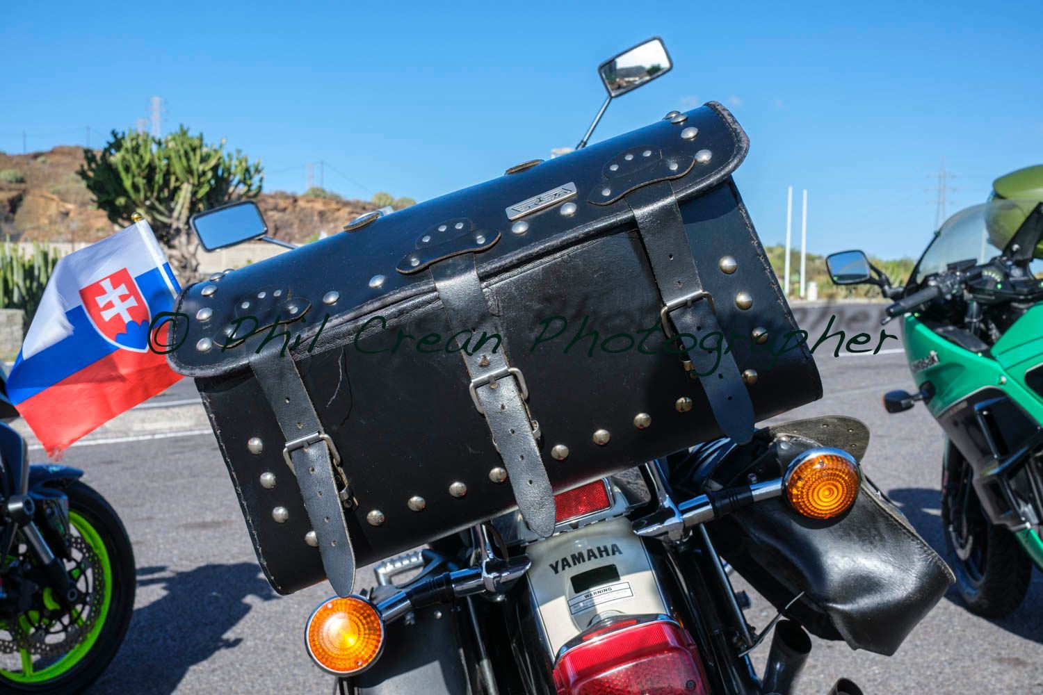 A motorcycle with a slovakian flag on the back of it
