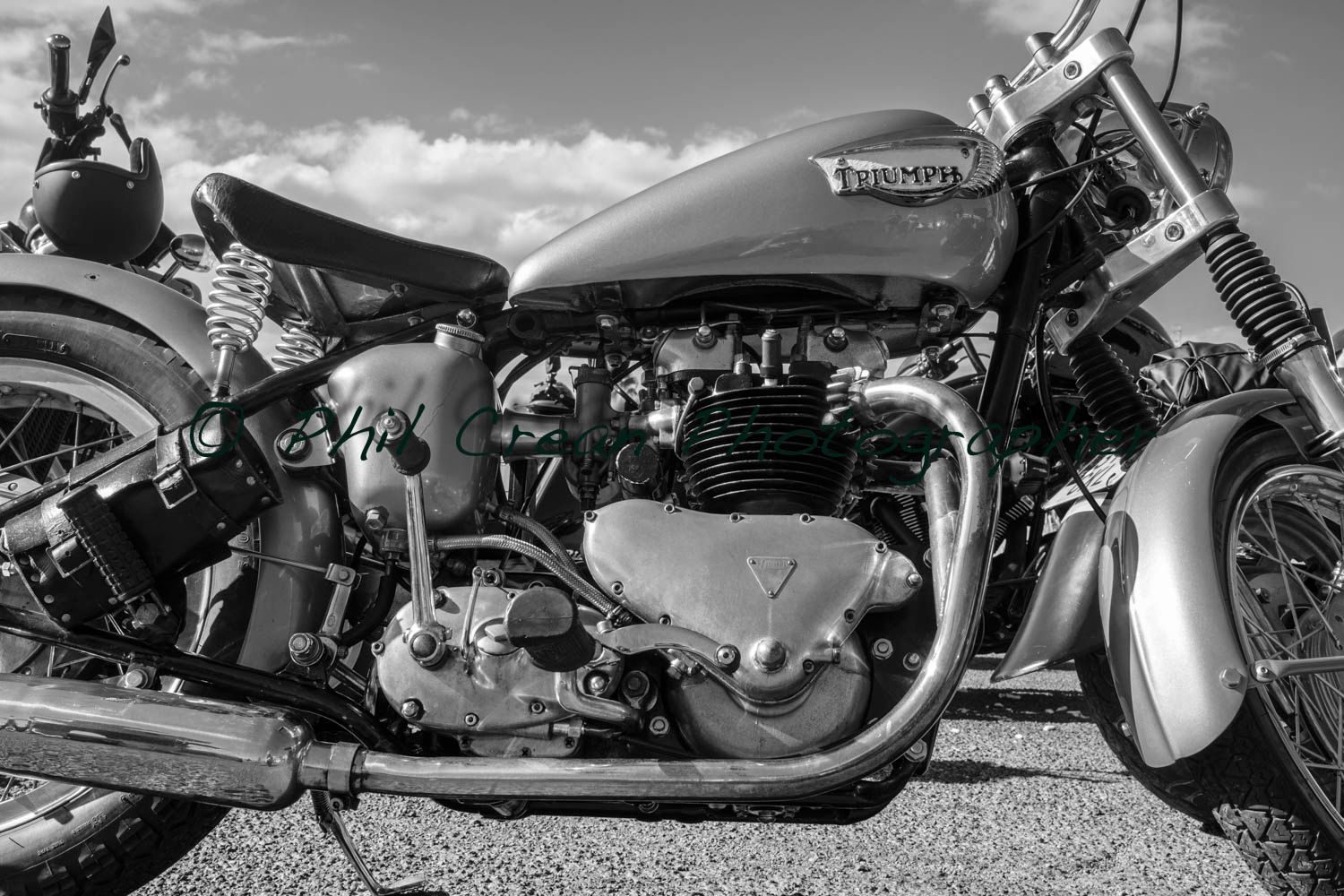 A black and white photo of a triumph motorcycle