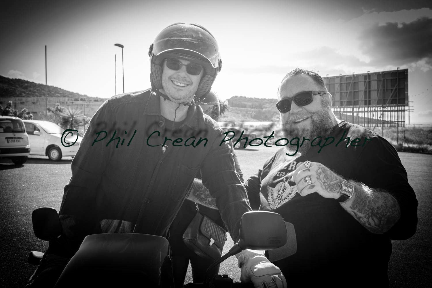 A black and white photo of two men on motorcycles taken by phil crow photography