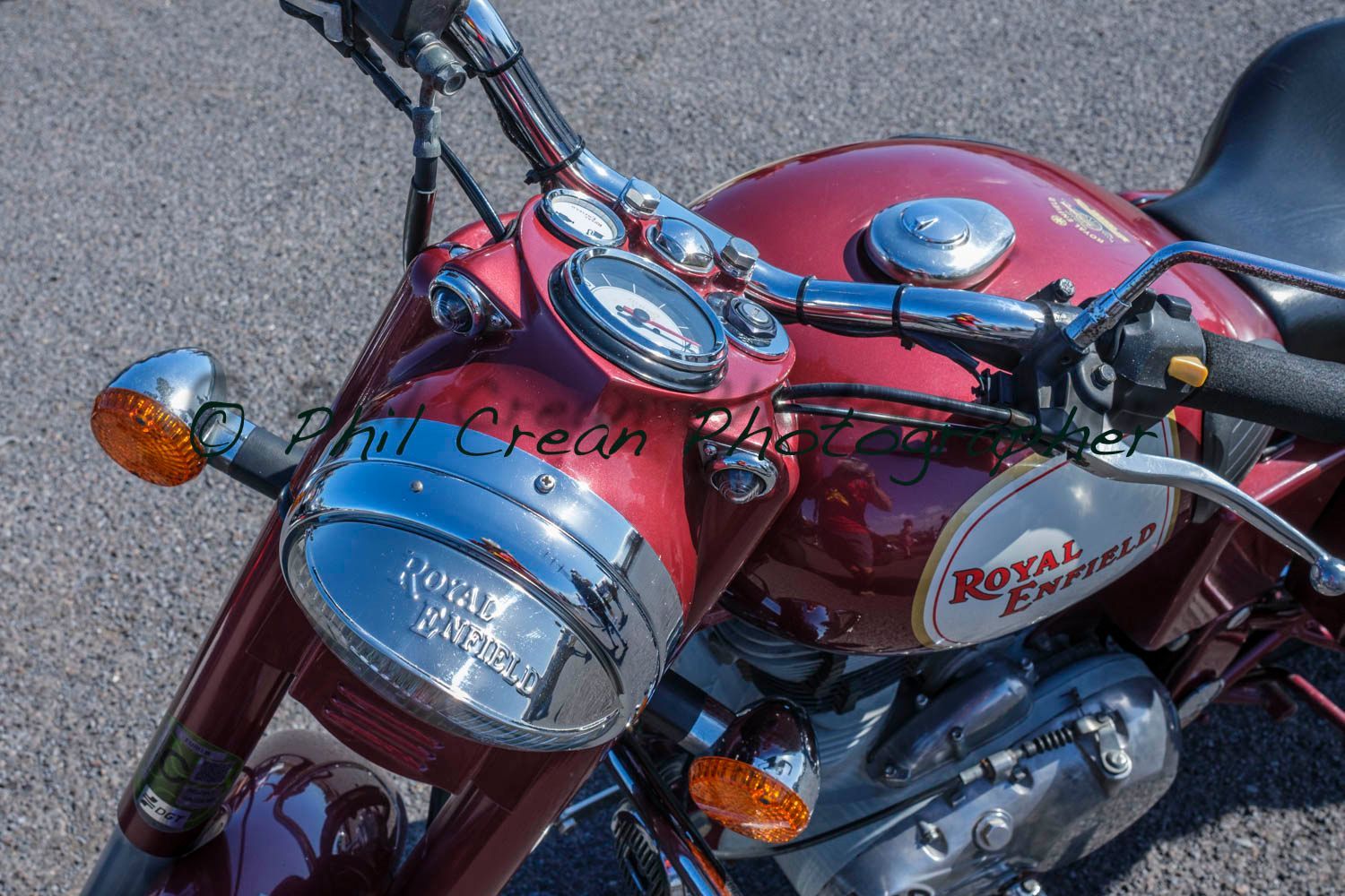 A red royal enfield motorcycle is parked on the road