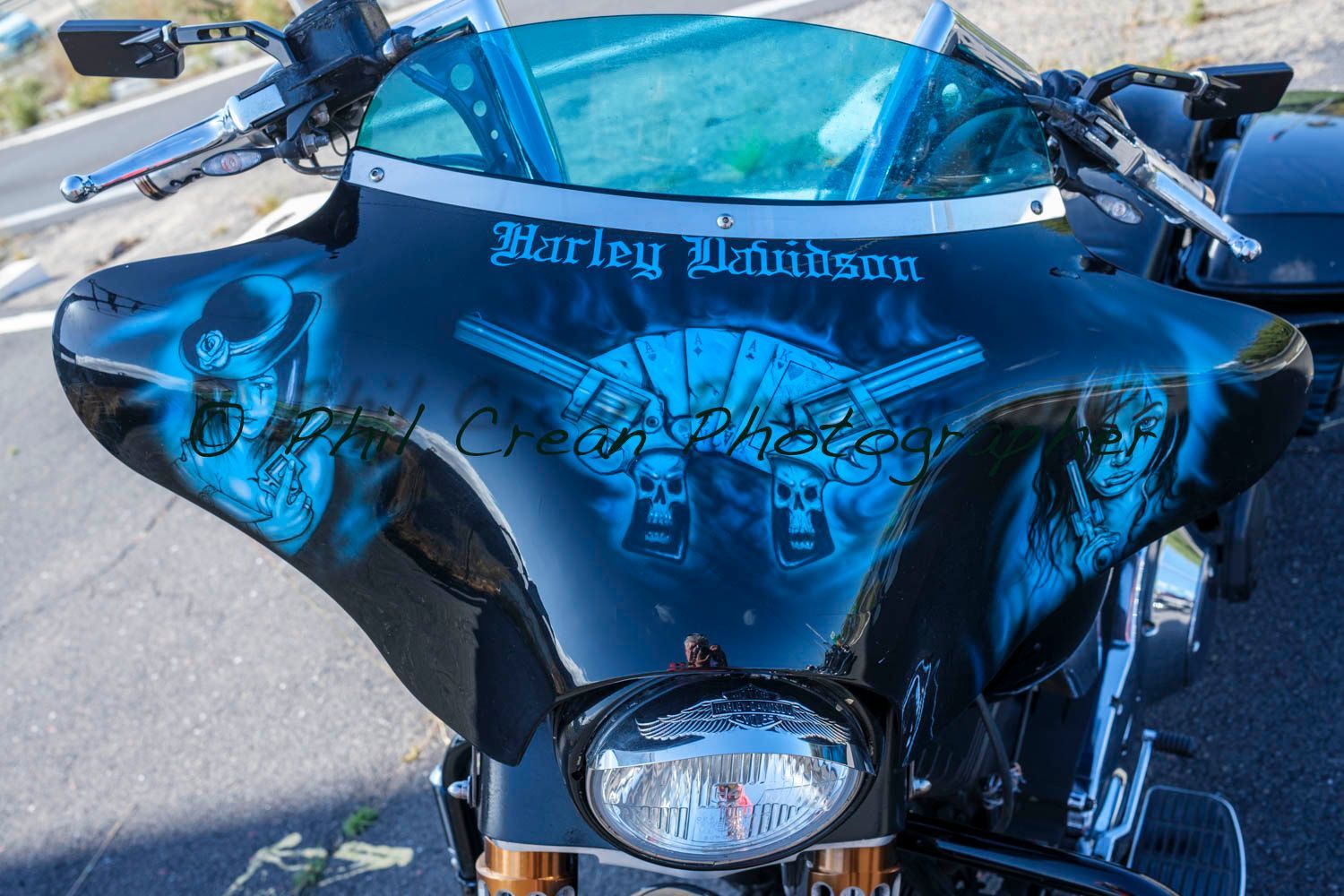 A harley davidson motorcycle is parked on the side of the road