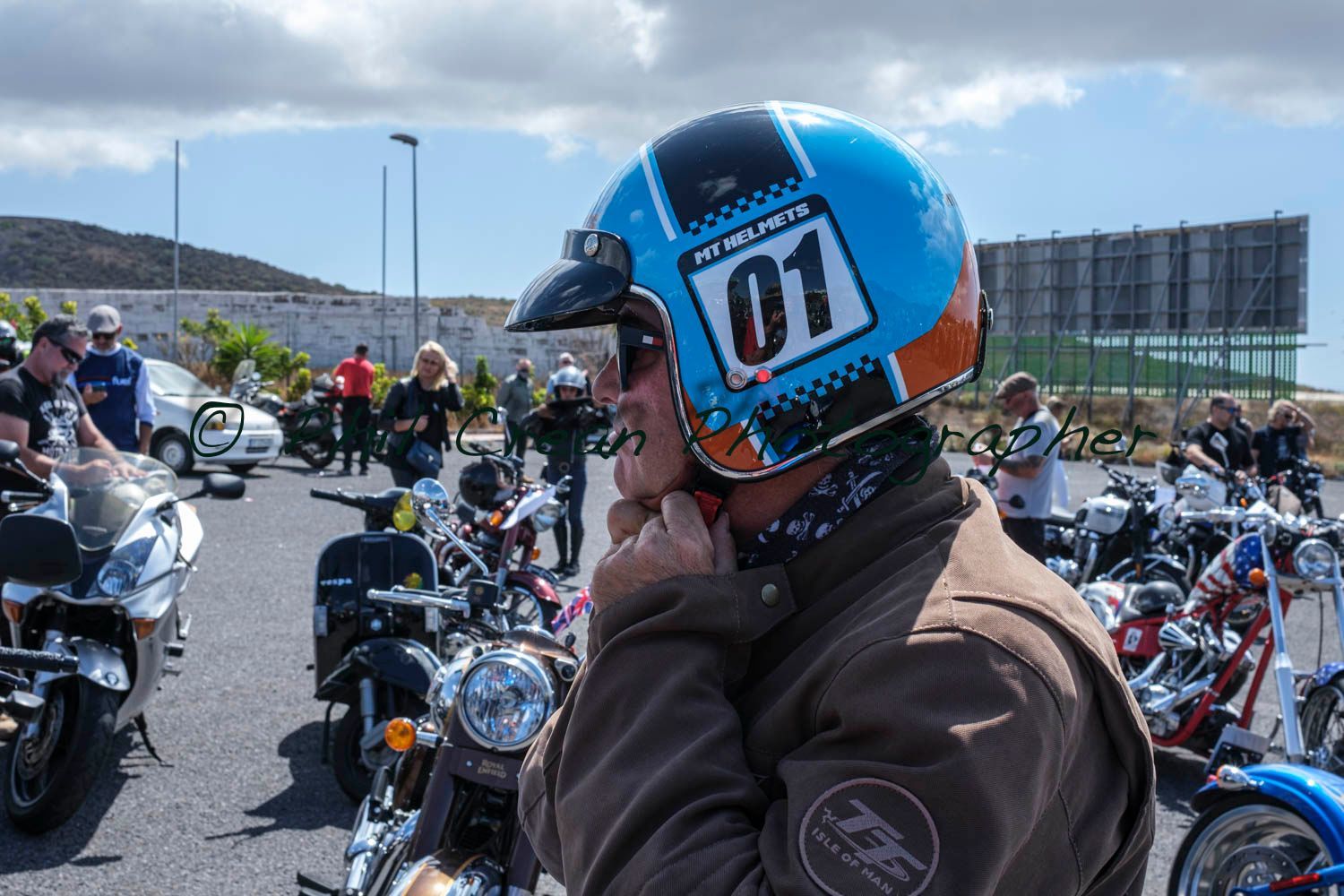 A man wearing a blue helmet with the number 01 on it
