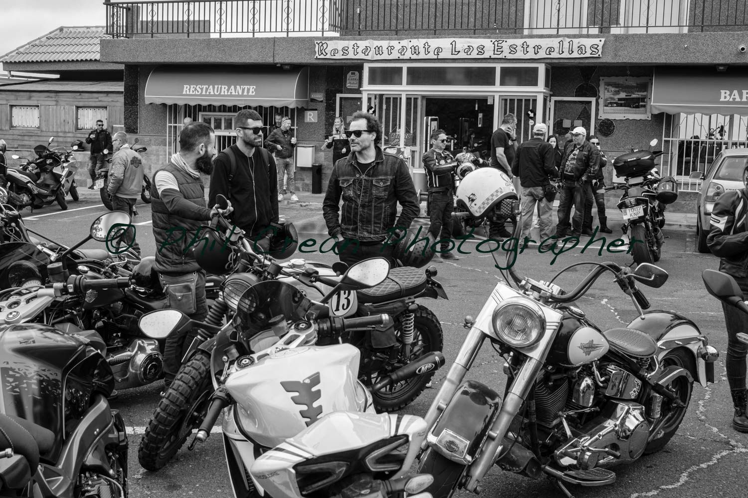 A black and white photo of a group of motorcycle riders