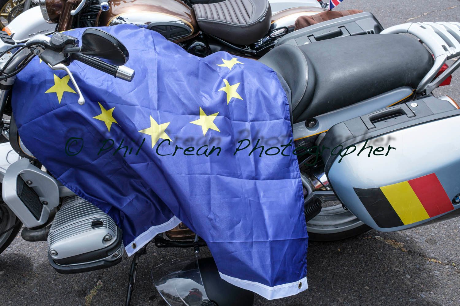 A motorcycle with a european flag on the side