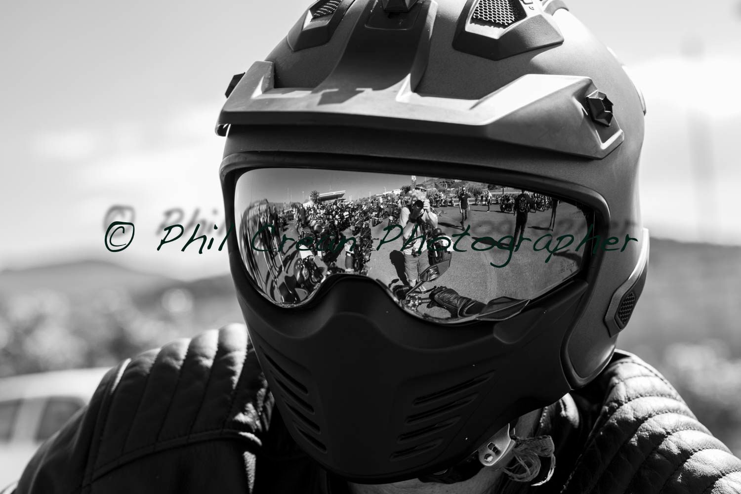 A black and white photo of a person wearing a helmet and goggles
