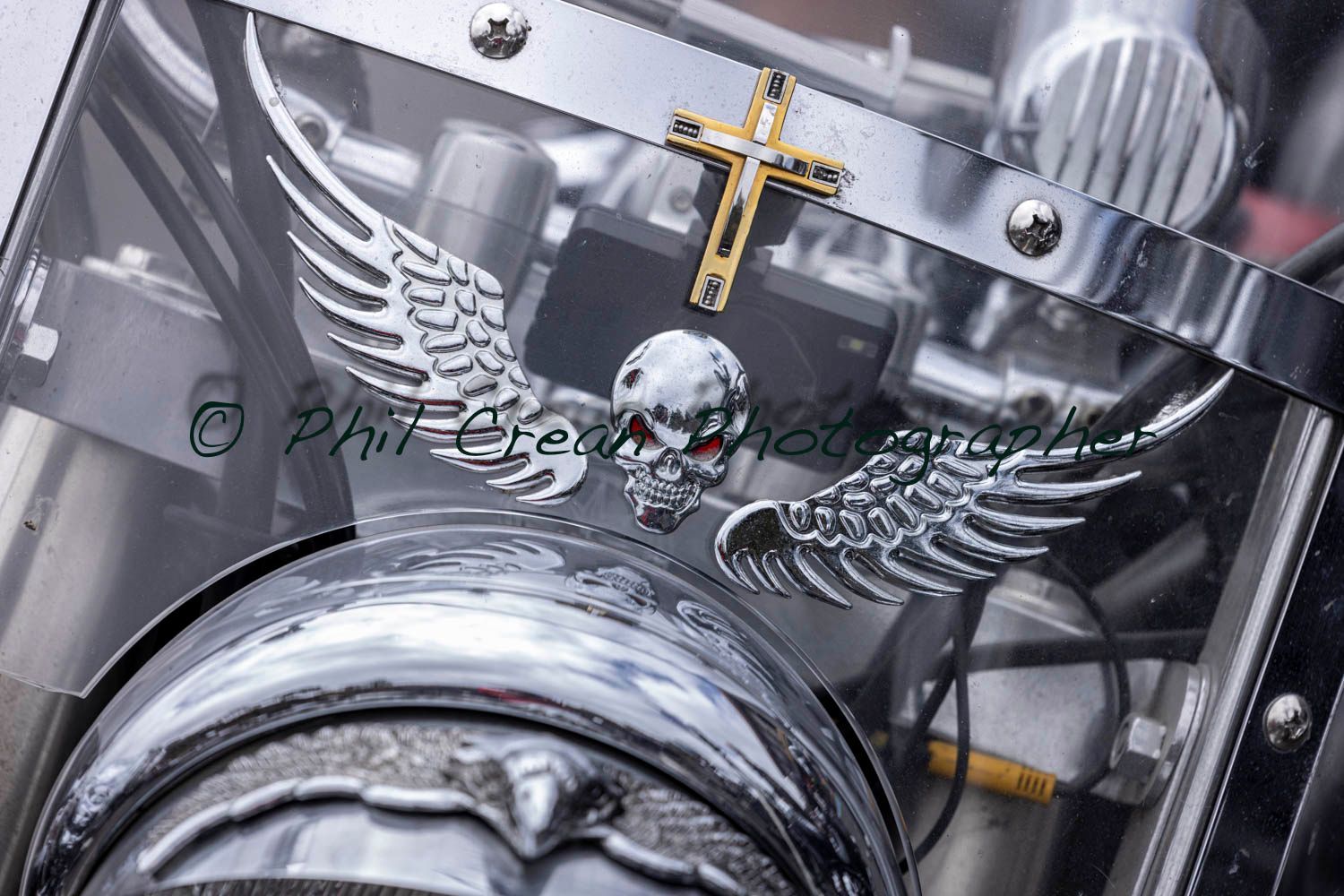 A motorcycle with a cross and a skull on it