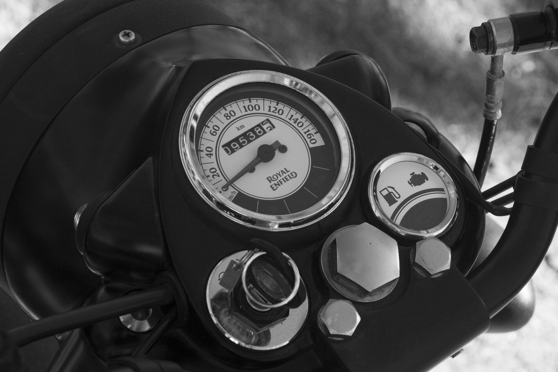 A black and white photo of a speedometer on a motorcycle