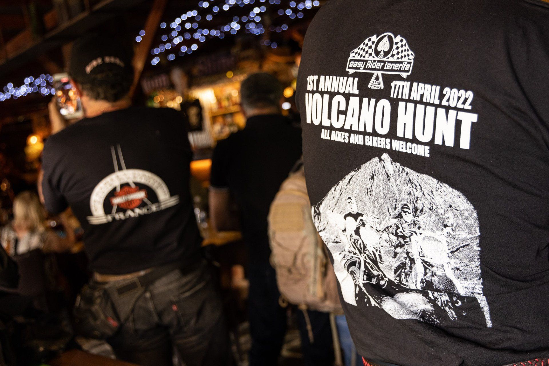 A man wearing a t-shirt that says ' tacano hunt ' on it
