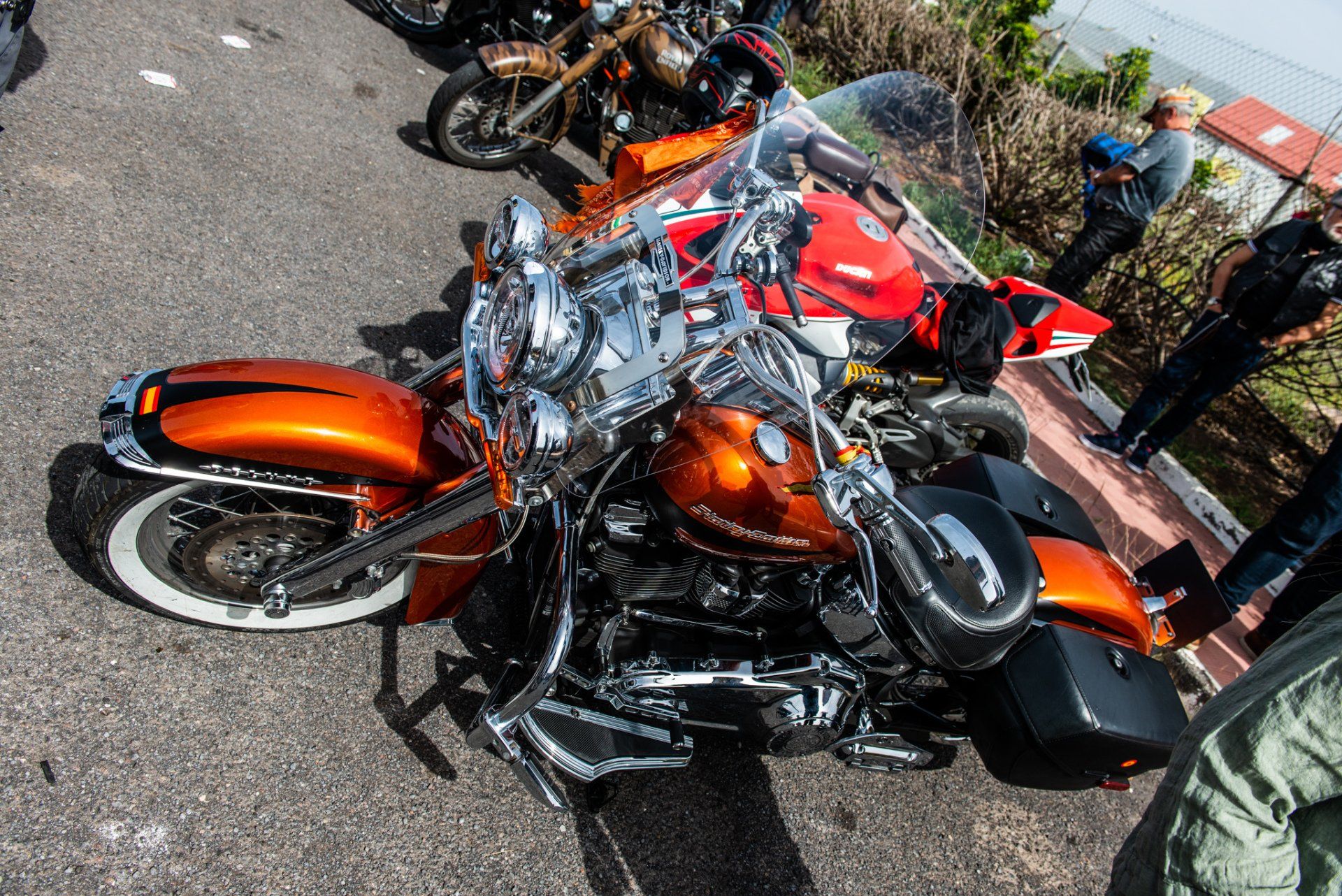 A harley davidson motorcycle is parked on the side of the road