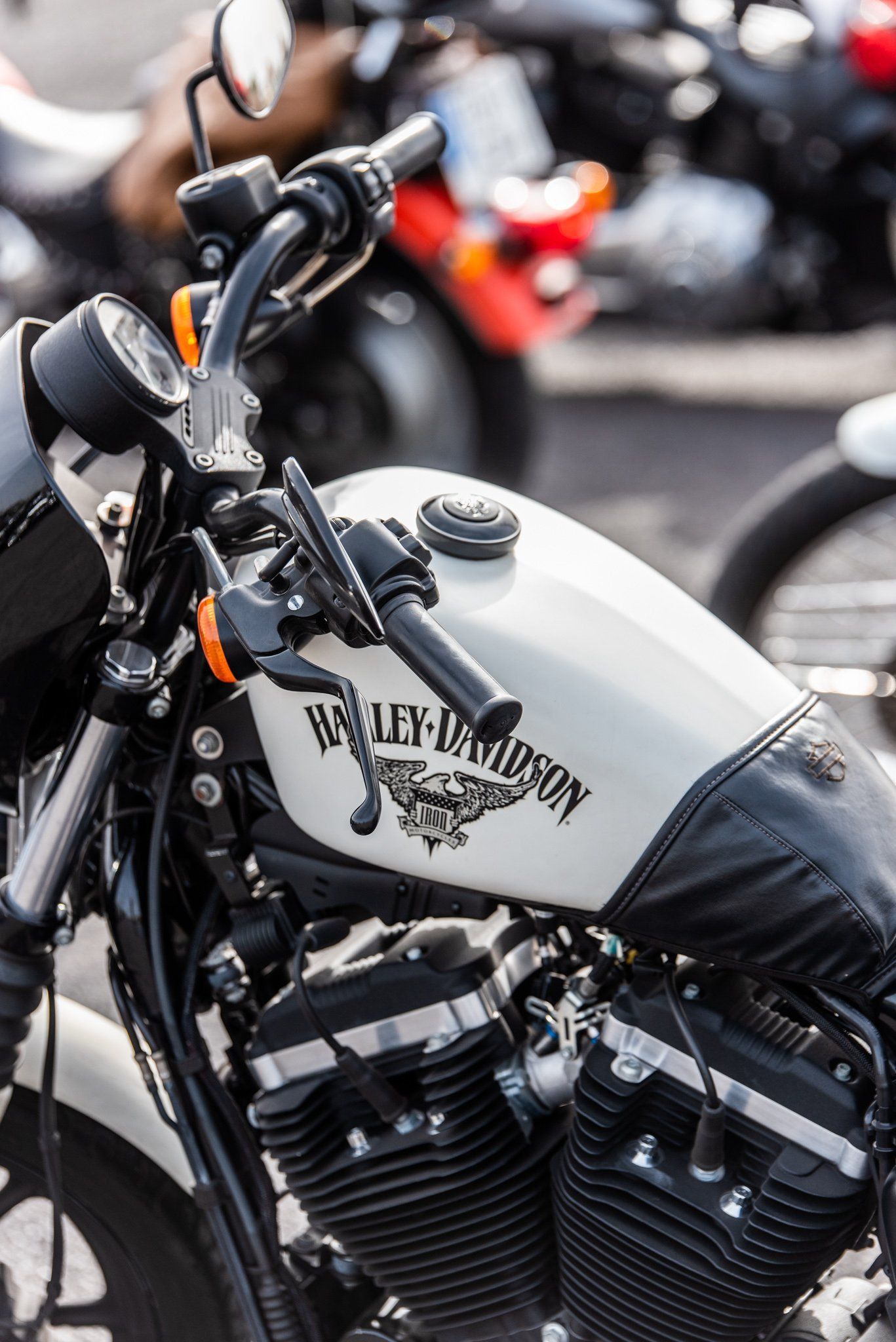 A harley davidson motorcycle is parked in a parking lot.