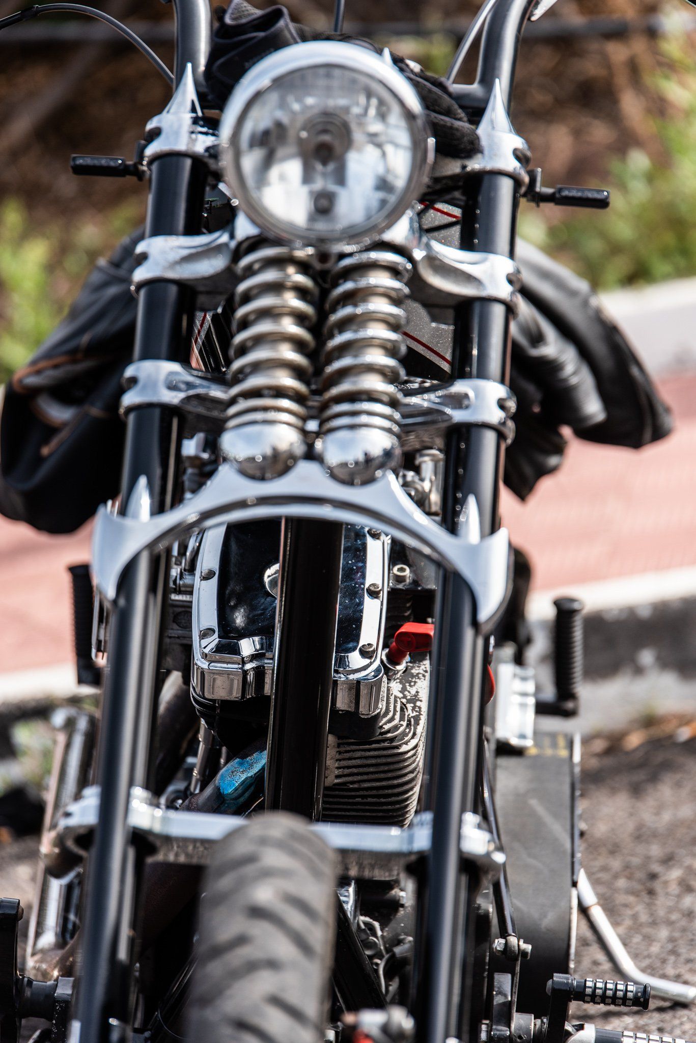 A motorcycle is parked on the side of the road.