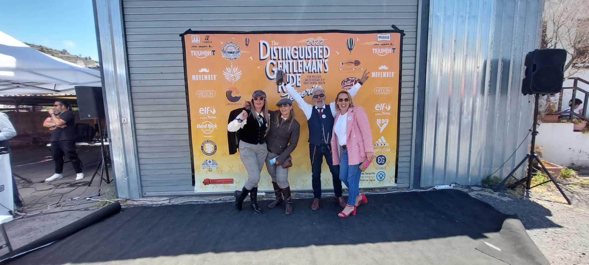 A group of people standing in front of a sign that says detective chronicles