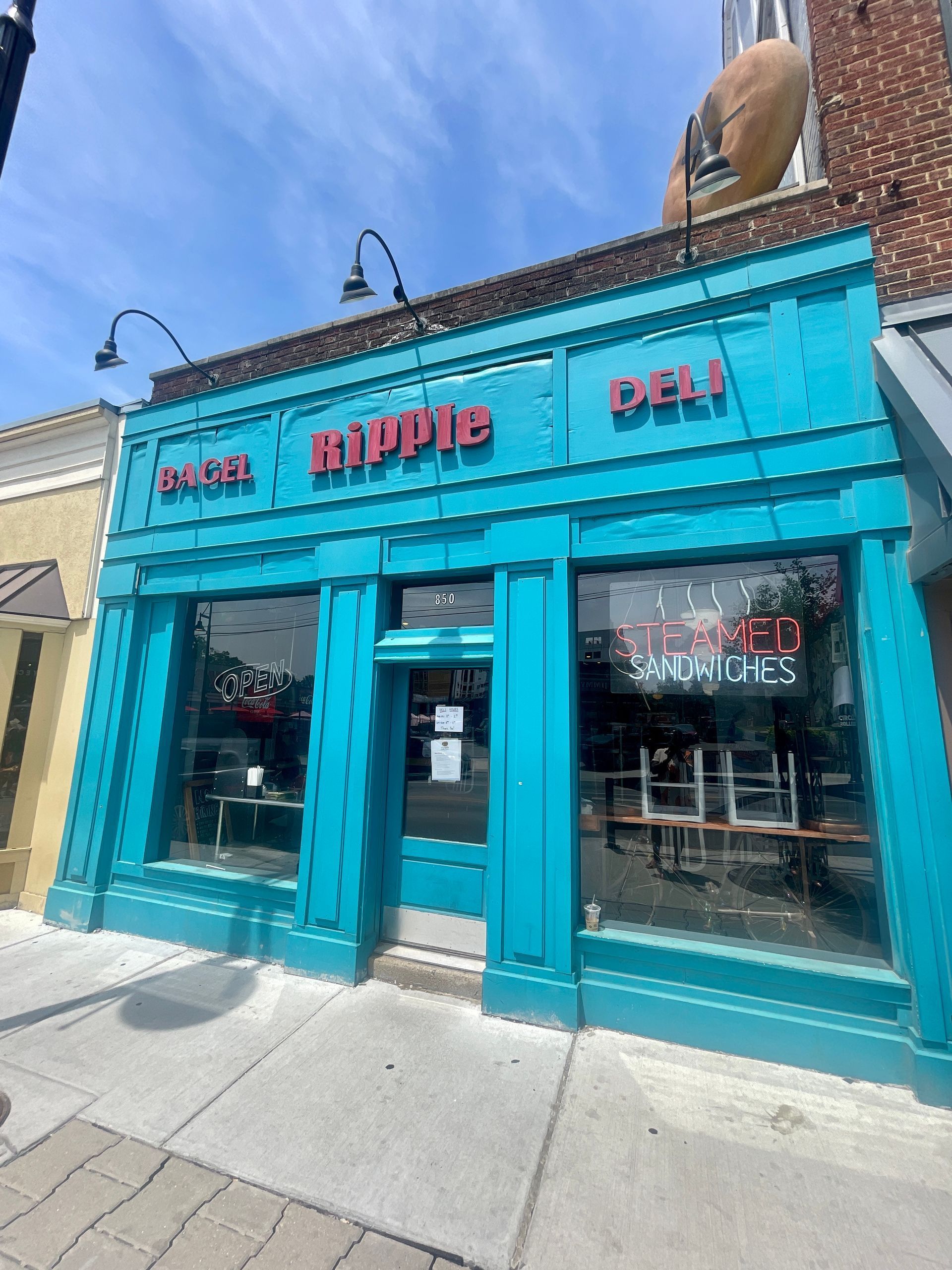 A blue building with a sign that says hippie deli